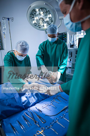 Surgeons performing operation in operation theater