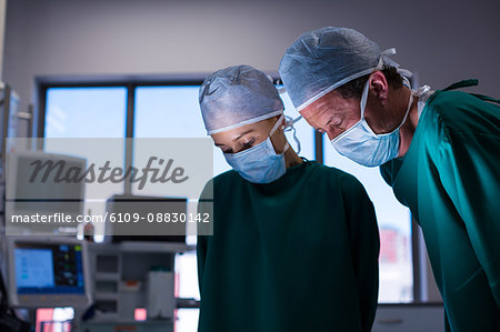 Surgeons performing operation in operation theater