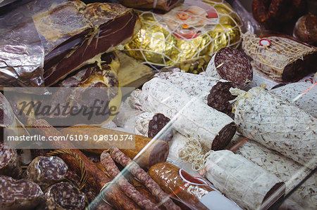 Various types of packed sausage and salami