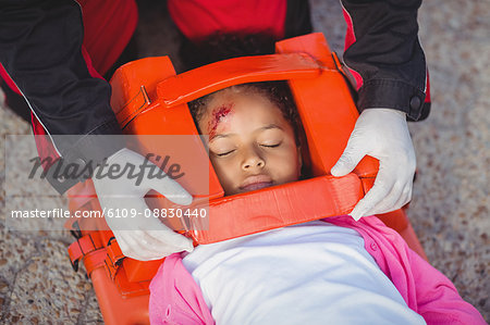 Injured girl treated by paramedic