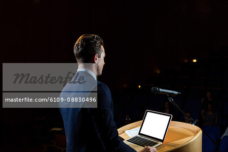 Male business executive giving a speech