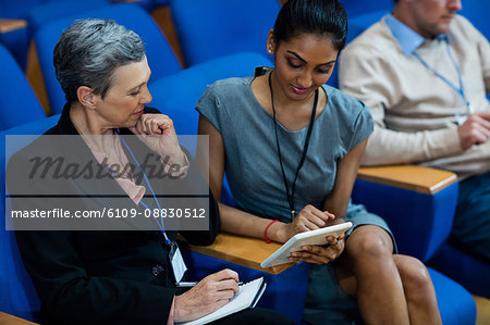 Business executives participating in a business meeting using digital tablet