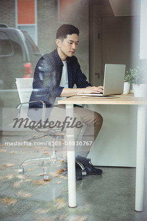 Business executive working on laptop
