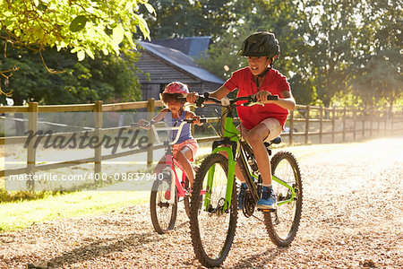 Two Children On Cycle Ride Together