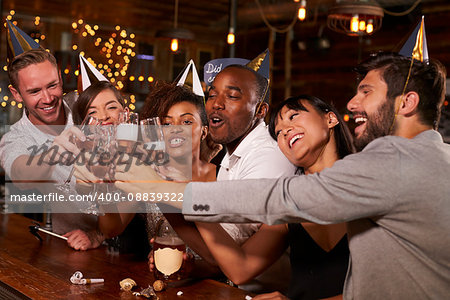 Friends toasting with champagne at New YearÕs party in a bar