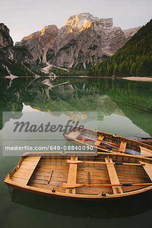 Boats moored at Lago di Braies, Dolomite Alps, Val di Braies, South Tyrol, Italy