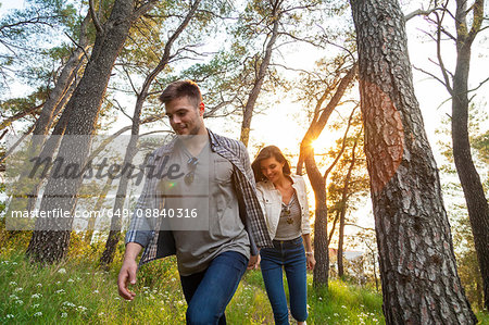 Young couple strolling in coastal forest, Split, Dalmatia, Croatia