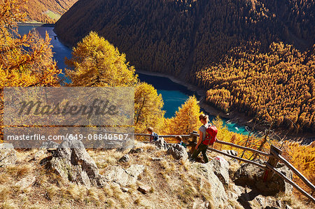 Family hiking along ridge, high angle view, Schnalstal, South Tyrol, Italy