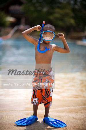 Boy wearing snorkel, mask and flippers