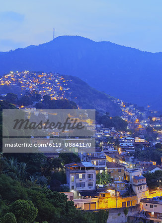 Twilight view of the favelas Unidos de Santa Teresa Morro do Escondidinho and Morro dos Prazeres, Rio de Janeiro, Brazil, South America