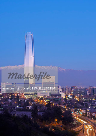 Twilight view from the Parque Metropolitano towards the high raised buildings with Costanera Center Tower, Santiago, Chile, South America