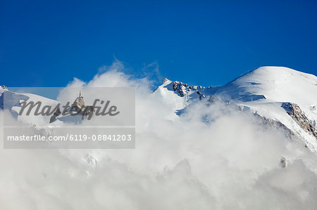 Mont Blanc, 4810m, and Aiguille du Midi cable car station, Chamonix, Haute Savoie, Rhone Alpes, French Alps, France, Europe