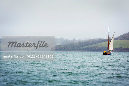 Traditional sailing boat off the coast of the estuary on the River Fal, Falmouth, Cornwall
