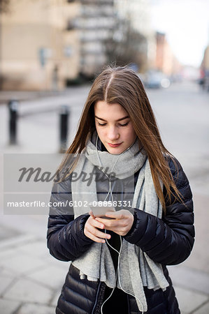 Teenage girl using cell phone