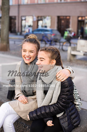 Teenage friends on bench