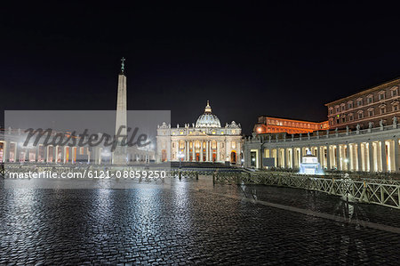 Illuminated cathedral and column at St Peter Square, Rome, Italy Illuminated cathedral and column at St Peter Square, Rome, Italy