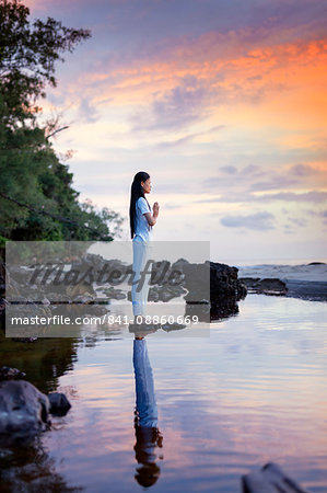 Cambodian woman standing in a yoga asana, Sihanoukville, Cambodia, Indochina, Southeast Asia, Asia