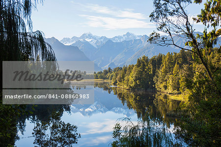 Mount Tasman and Aoraki (Mount Cook) reflected in Lake Matheson, Westland Tai Poutini National Park, UNESCO World Heritage Site, West Coast, South Island, New Zealand, Pacific Mount Tasman and Aoraki (Mount Cook) reflected in Lake Matheson, Westland Tai Poutini National Park, UNESCO World Heritage Site, West Coast, South Island, New Zealand, Pacific