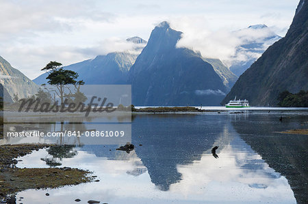 View down Milford Sound, mountains reflected in water, Milford Sound, Fiordland National Park, UNESCO World Heritage Site, Southland, South Island, New Zealand, Pacific