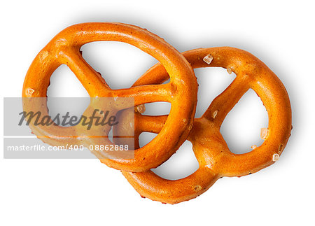Two crunchy pretzels with salt on each other isolated on white background