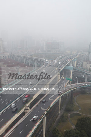 Elevated roadways meet in the mist, Changning Qu, Shanghai, China