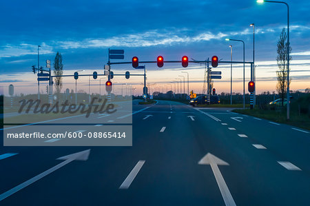 Road Intersection with Red Traffic Light at Dusk, Netherlands