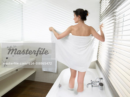 Woman getting out of the bathtub