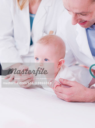 two medics tending to a baby