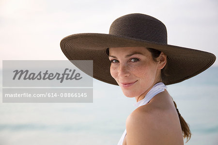 Woman on Beach Smiling at Camera