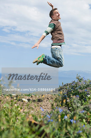 young man jumping in air