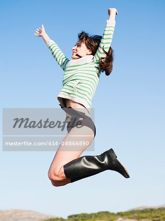 woman jumping into the air