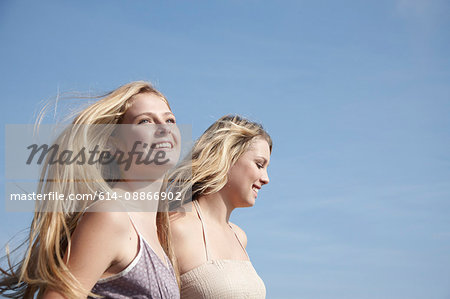 Two female friends walking outdoors