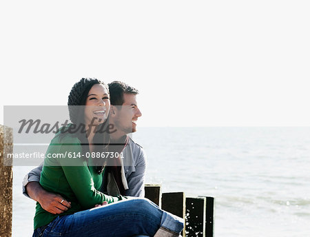 Couple sharing moment by the sea