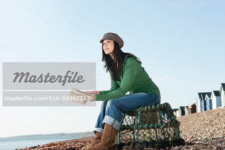 Young woman looking out to sea
