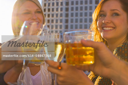 friends on roof top in city having party