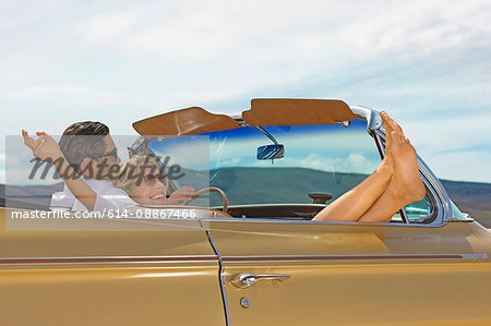 Happy couple in convertible