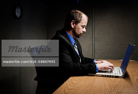 Man working at computer on desk