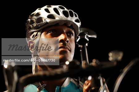 Man poised on bike