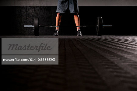 Man standing with weights