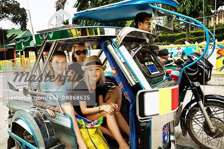 Family riding in alternative transport