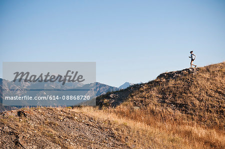 Woman running on dirt path