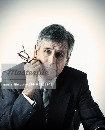 Sad businessman sitting at desk