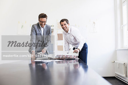 Businessman reading book in office