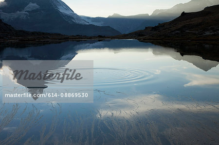 Ripple in still mountain lake