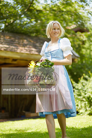 Woman with basket of fresh vegetables