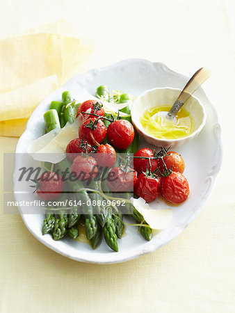 Plate of roasted vegetables and butter