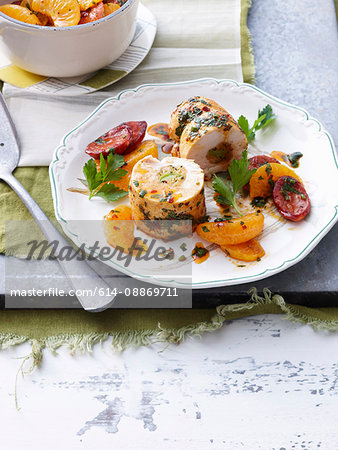 Plate of stuffed chicken and vegetables