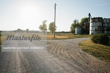 Grain silos on rural gravel road