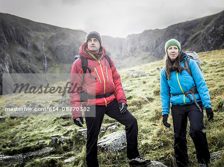 Couple hiking in rocky landscape