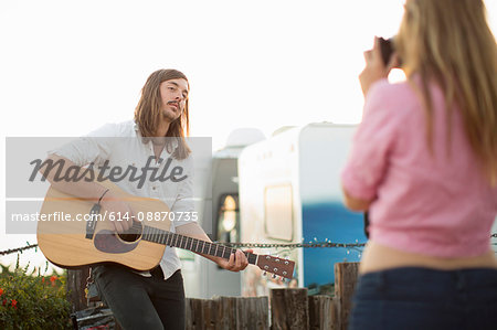 Woman taking picture of boyfriend